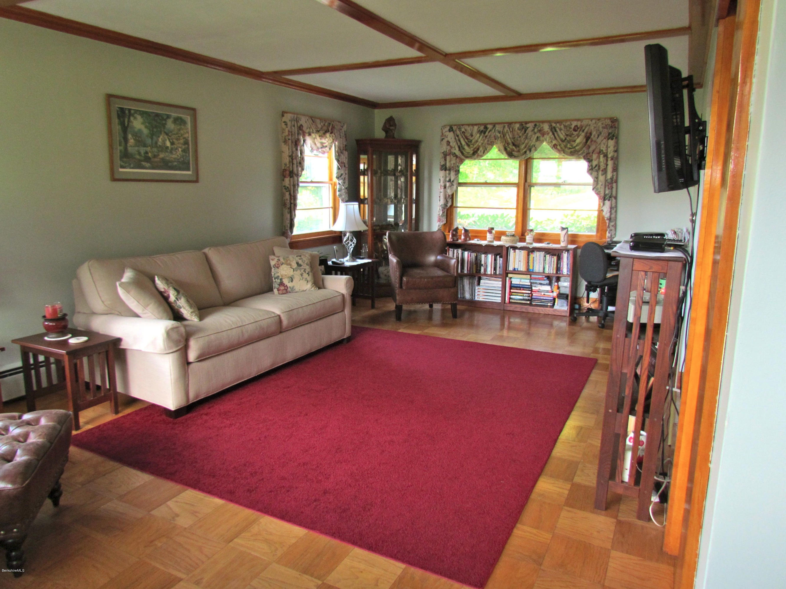 102 Clough Road Stamford, VT 05352 - Photo 8 of 13 a living room with furniture and a large window