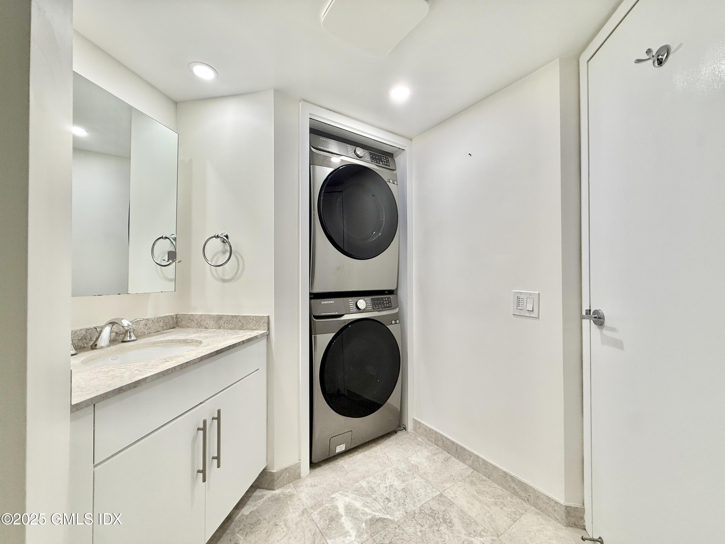 25 Forest Street, Unit 8C Stamford, CT 06901 - Photo 13 of 25 a bathroom with a sink a mirror and a toilet