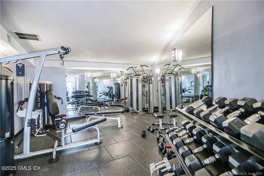 25 Forest Street, Unit 8C Stamford, CT 06901 - Photo 18 of 25 a view of a room with gym equipment