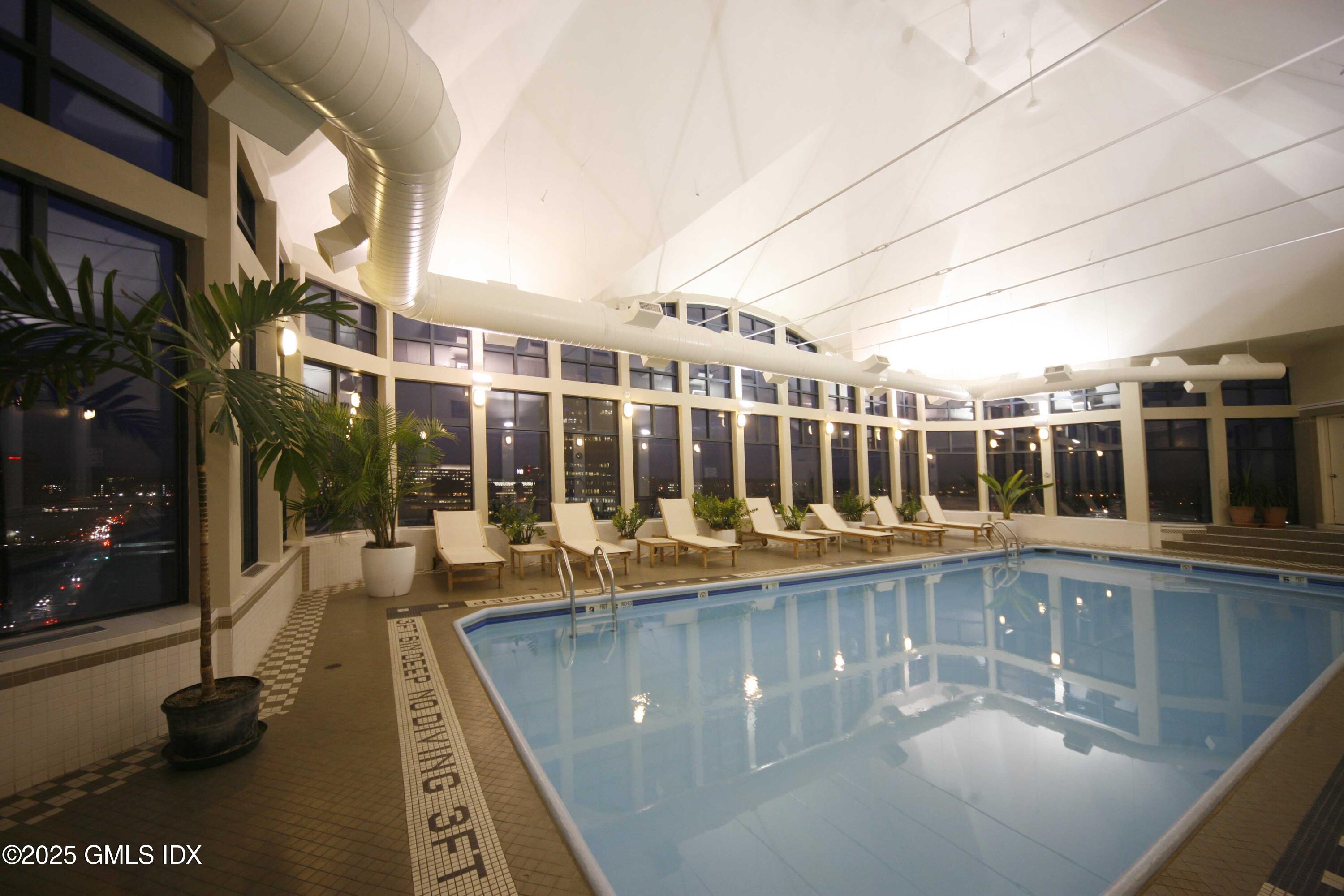 25 Forest Street, Unit 8C Stamford, CT 06901 - Photo 20 of 25 a view of a patio with swimming pool