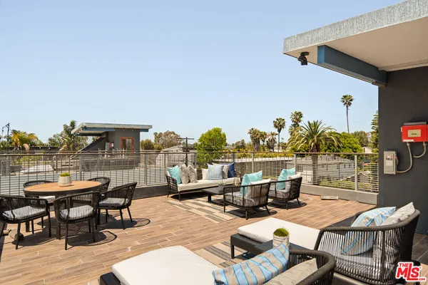 a view of a terrace with furniture