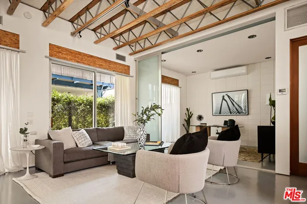 a dining room with table and chairs