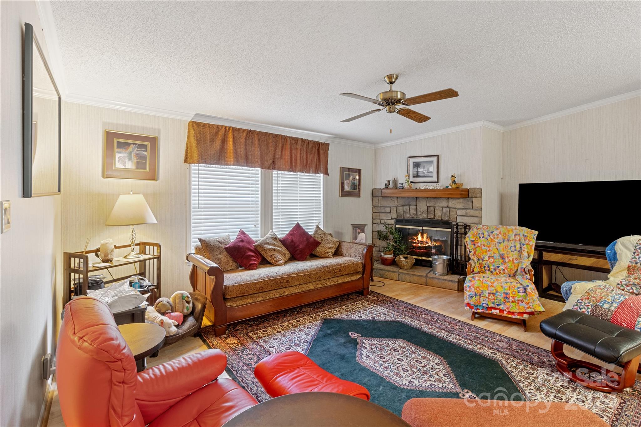 65 Fraser Hill Drive Mars Hill, NC 28754 - Photo 11 of 39 a living room with furniture a fireplace and a window