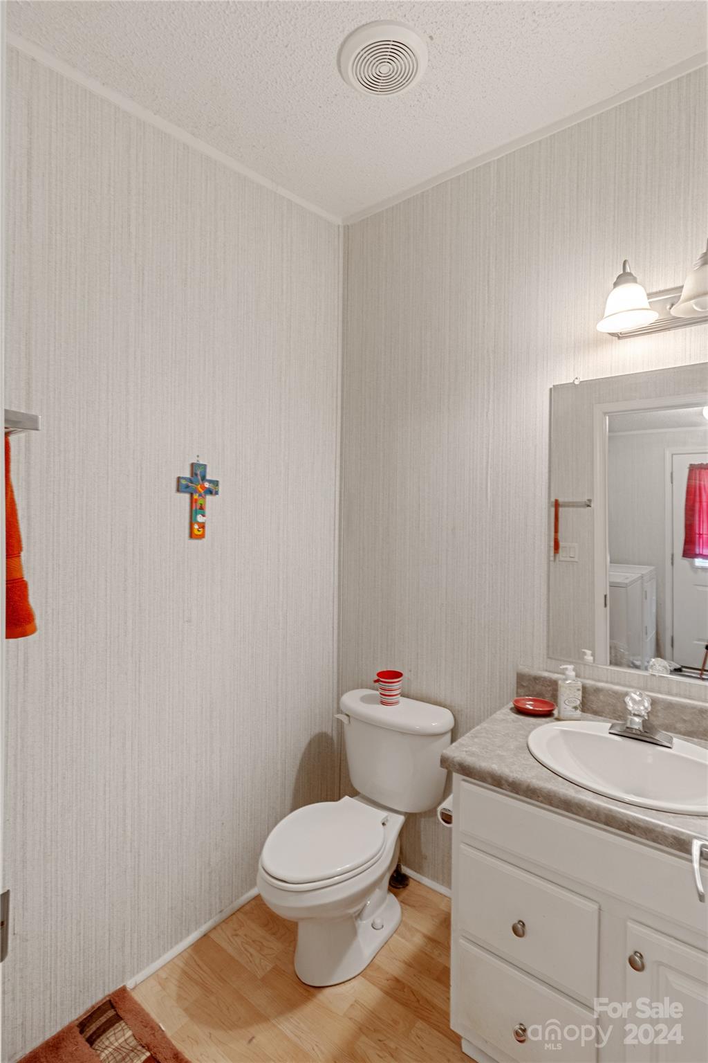 65 Fraser Hill Drive Mars Hill, NC 28754 - Photo 32 of 39 a bathroom with a sink mirror vanity and toilet