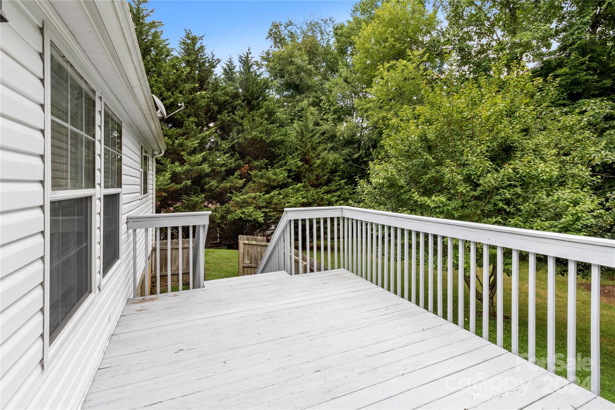 65 Fraser Hill Drive Mars Hill, NC 28754 - Photo 4 of 39 a balcony with trees in front of it