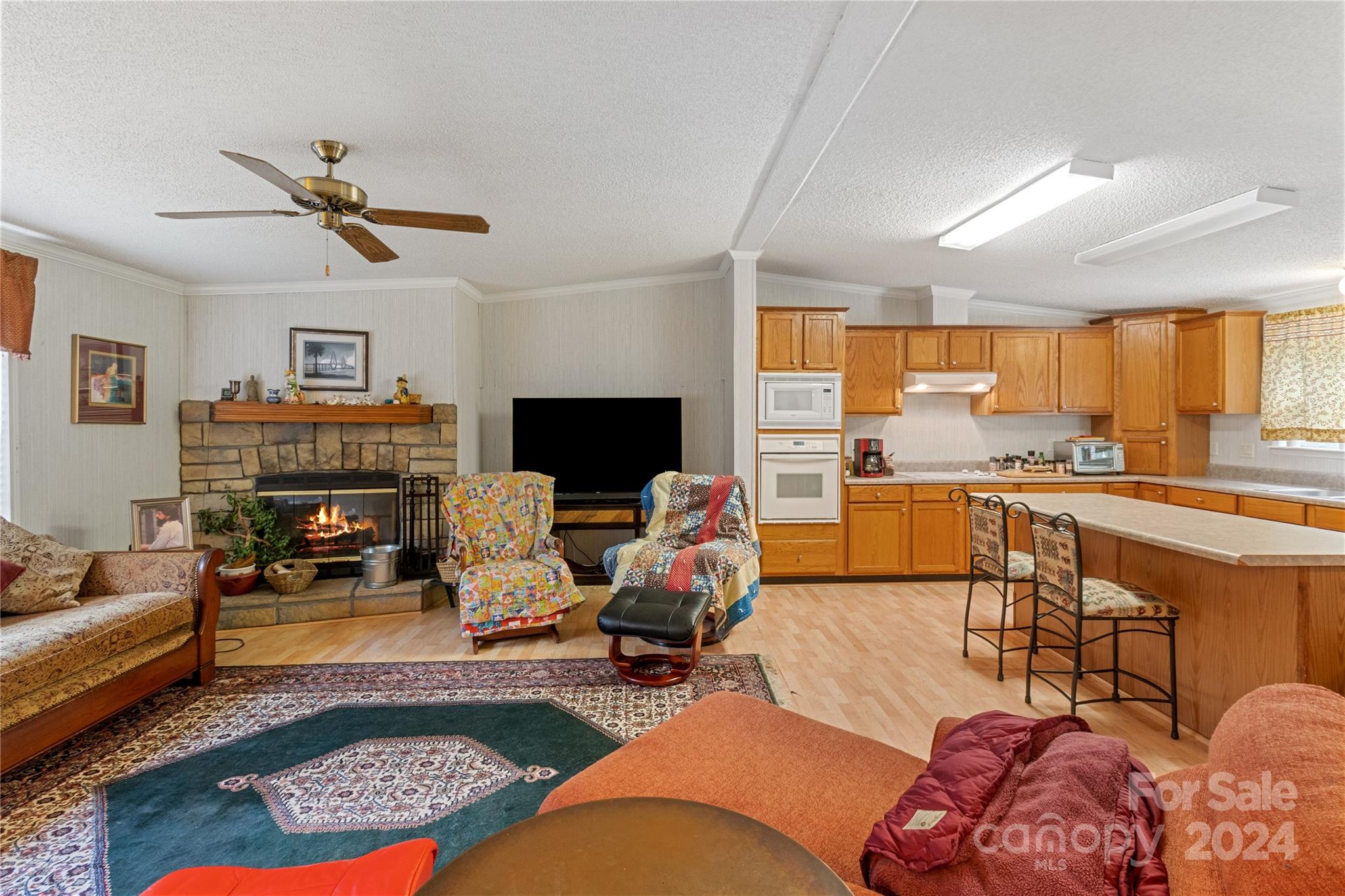65 Fraser Hill Drive Mars Hill, NC 28754 - Photo 10 of 39 a living room with furniture and a fireplace