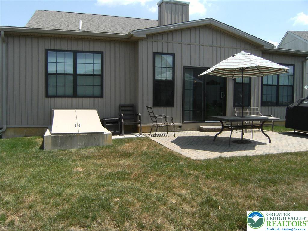 4088 Eveningstar Road Emmaus, PA 18049 - Photo 15 of 78 a swimming pool with patio outdoor seating and yard