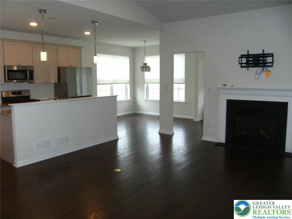 4088 Eveningstar Road Emmaus, PA 18049 - Photo 17 of 78 a view of kitchen with furniture and a fireplace