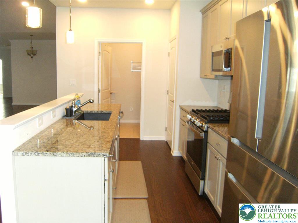 4088 Eveningstar Road Emmaus, PA 18049 - Photo 20 of 78 a kitchen with a sink stove and refrigerator