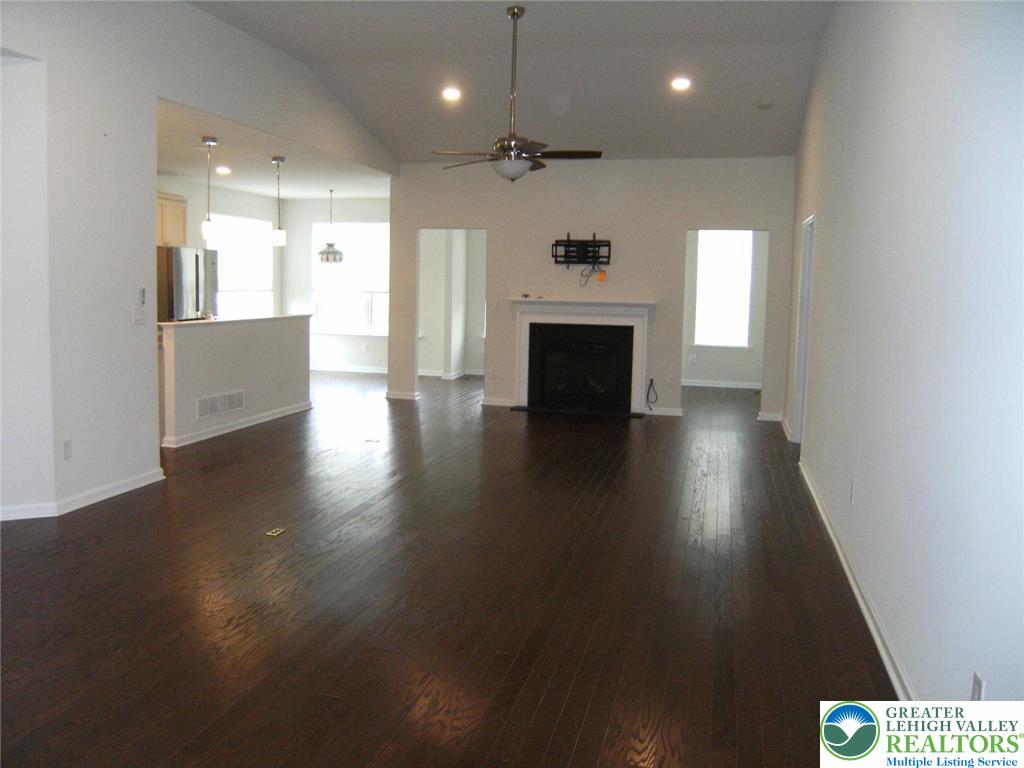 4088 Eveningstar Road Emmaus, PA 18049 - Photo 29 of 78 an open space with kitchen view and a fireplace
