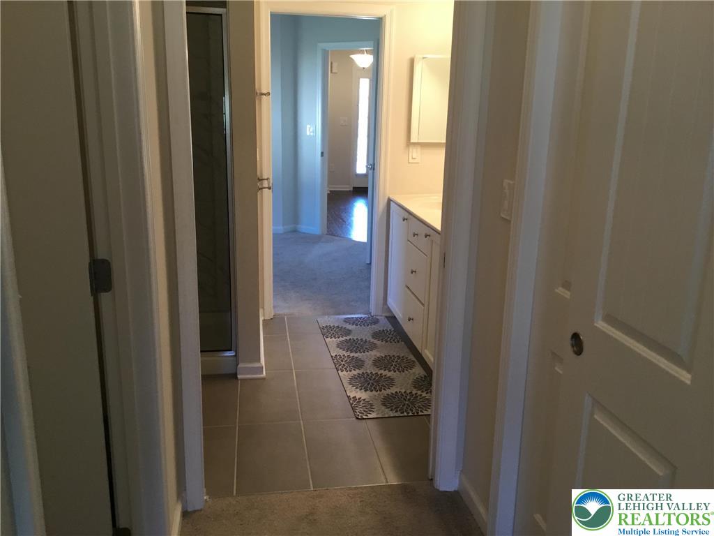 4088 Eveningstar Road Emmaus, PA 18049 - Photo 62 of 78 a view of a hallway with wooden floor
