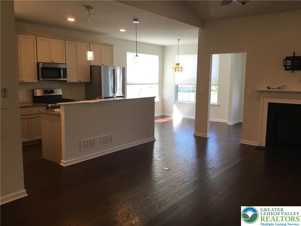 4088 Eveningstar Road Emmaus, PA 18049 - Photo 72 of 78 a living room with stainless steel appliances wooden floors and view kitchen