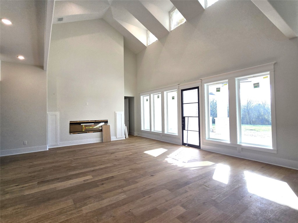 15408 Highlander Court Montgomery, TX 77356 - Photo 17 of 35 a view of an empty room with a window and wooden floor