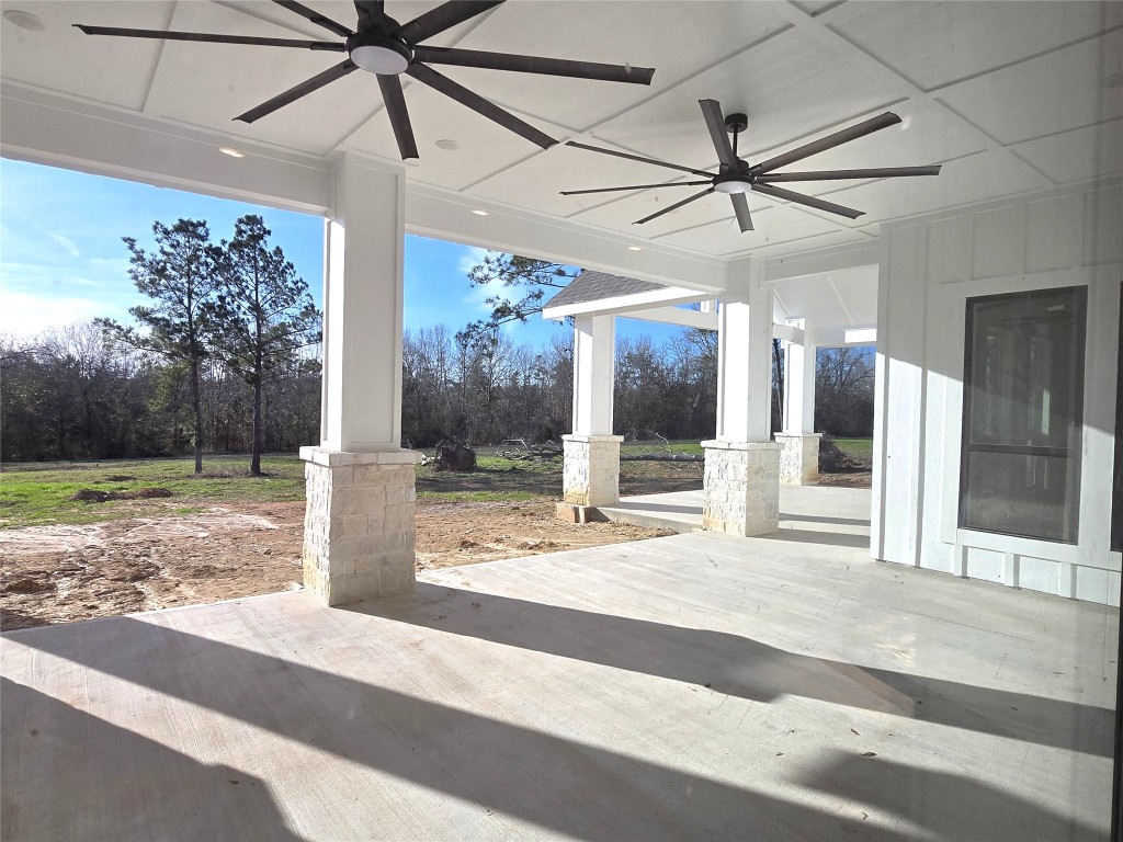 15408 Highlander Court Montgomery, TX 77356 - Photo 18 of 35 a view of a flesh screen tv and a fire pit