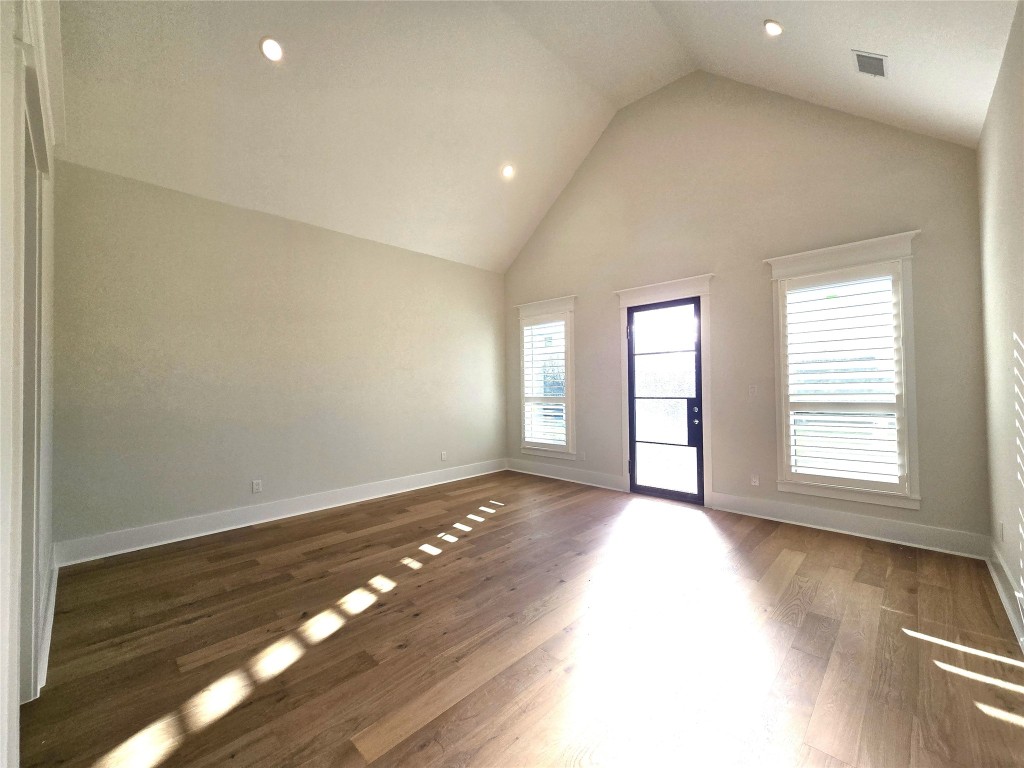 15408 Highlander Court Montgomery, TX 77356 - Photo 20 of 35 a view of an empty room with wooden floor and a window