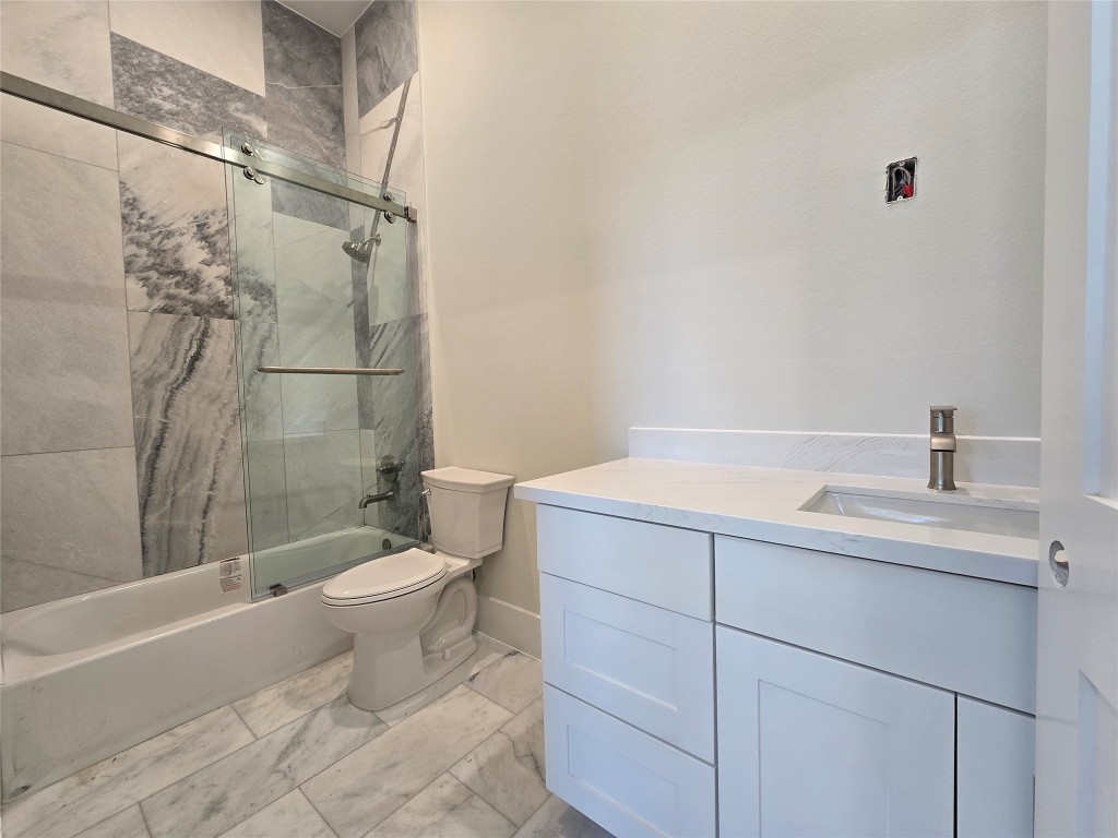 15408 Highlander Court Montgomery, TX 77356 - Photo 25 of 35 a bathroom with a sink toilet and shower