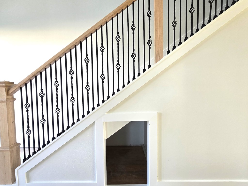 15408 Highlander Court Montgomery, TX 77356 - Photo 27 of 35 a view of staircase with railing and white walls