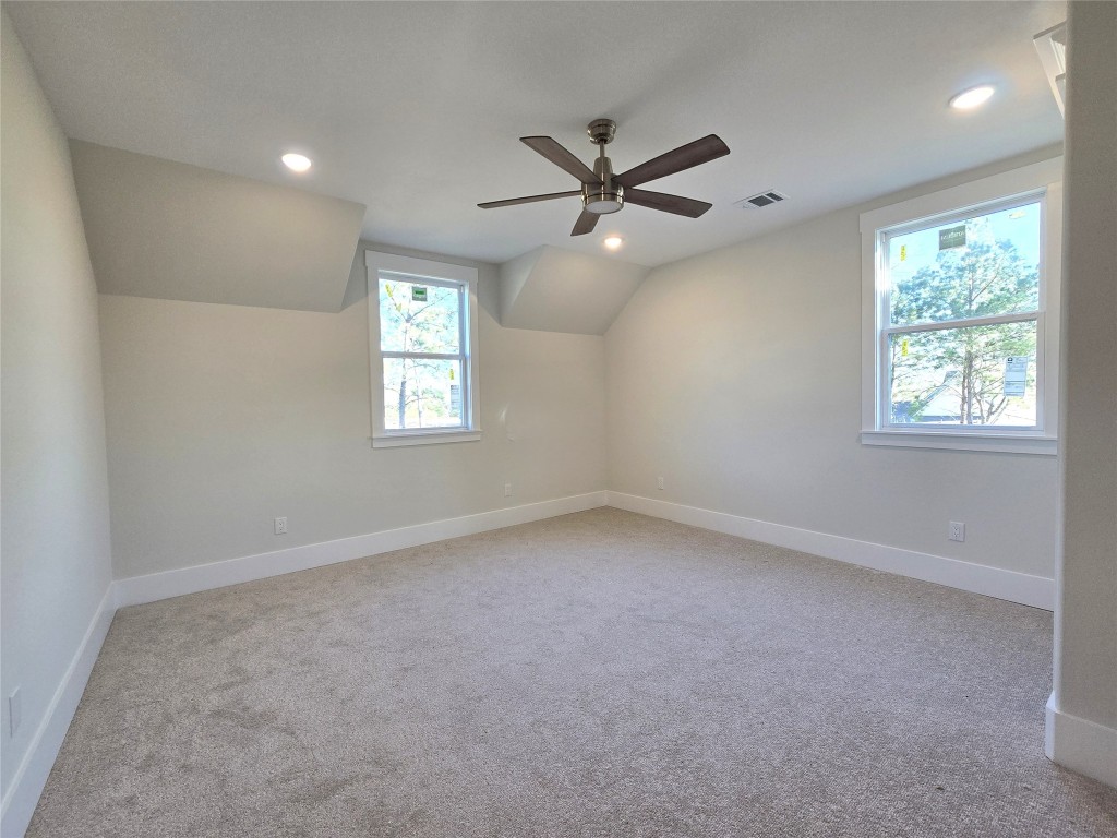 15408 Highlander Court Montgomery, TX 77356 - Photo 30 of 35 an empty room with a window and a fan