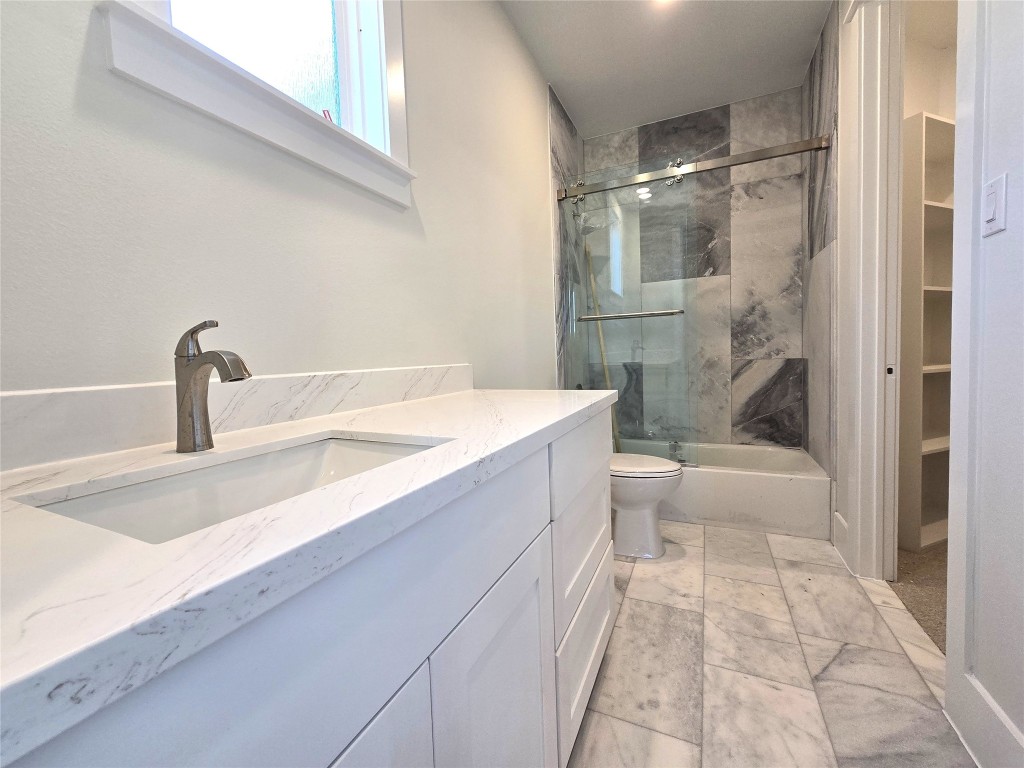 15408 Highlander Court Montgomery, TX 77356 - Photo 31 of 35 a bathroom with a sink a toilet and shower