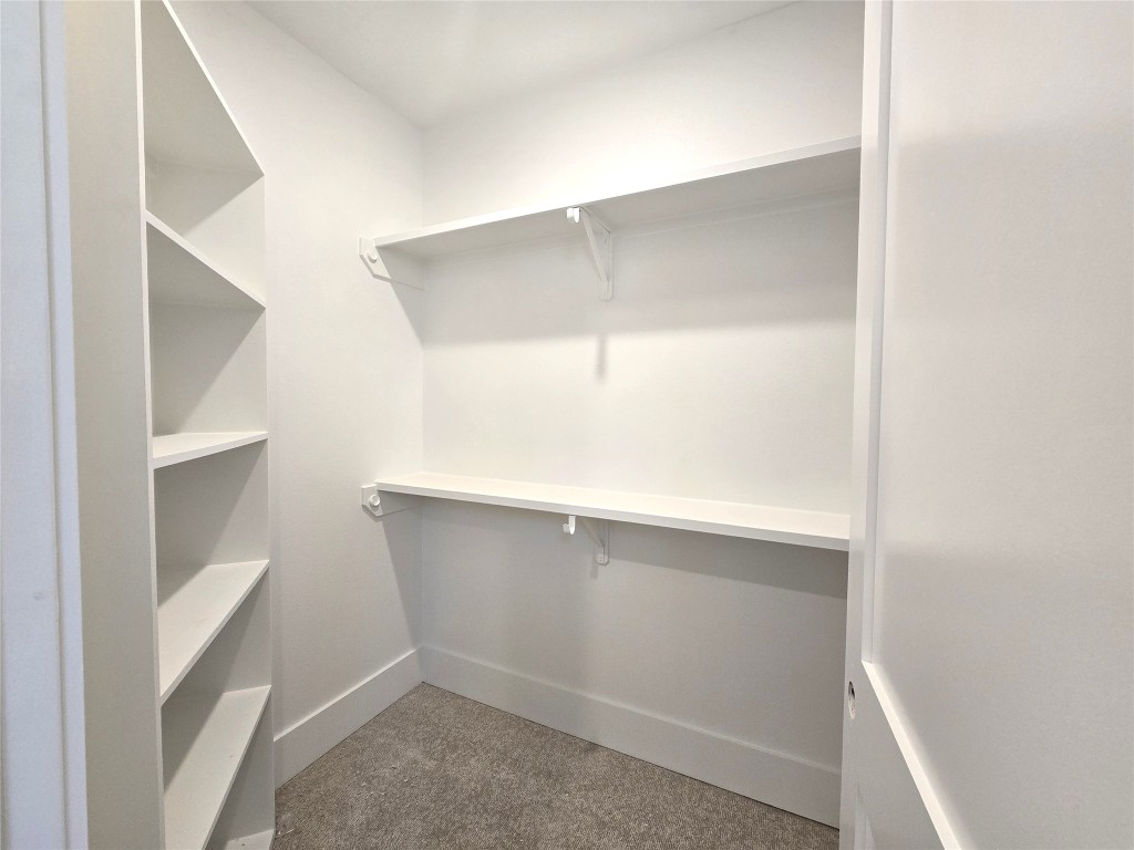 15408 Highlander Court Montgomery, TX 77356 - Photo 32 of 35 a view of an empty walk in closet