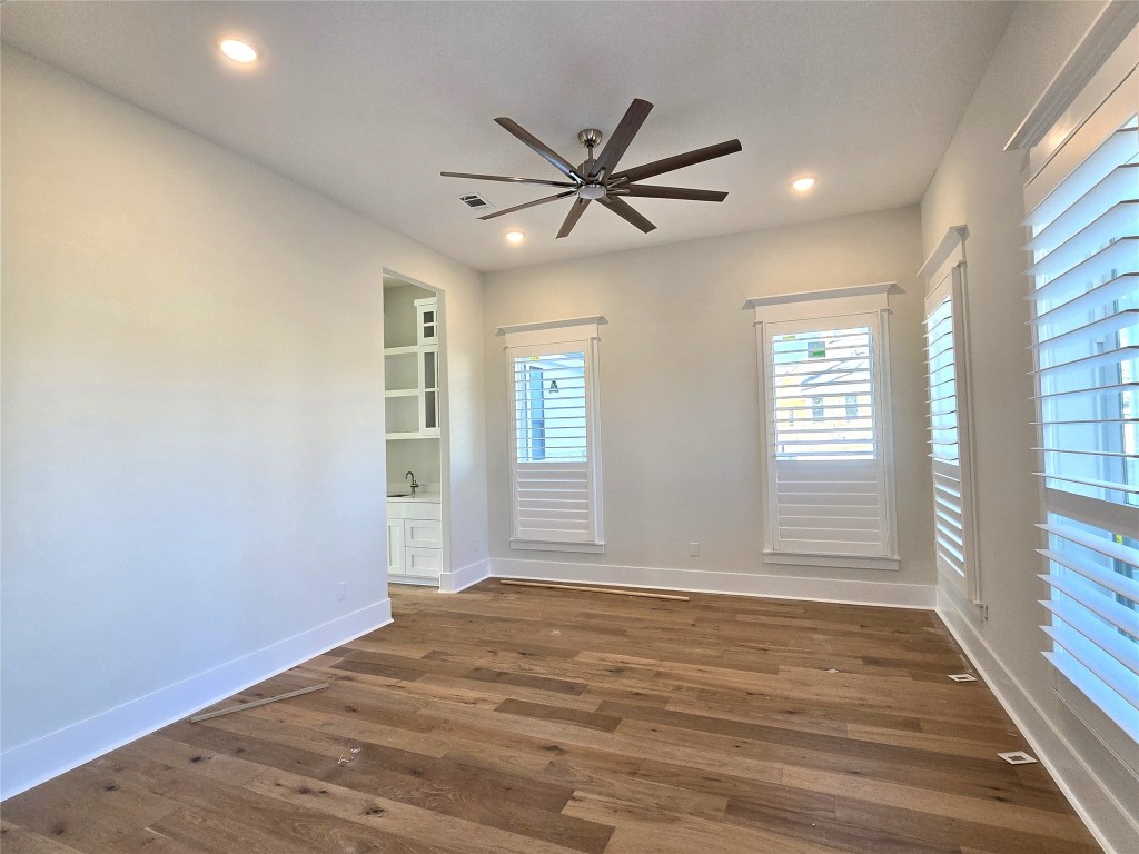 15408 Highlander Court Montgomery, TX 77356 - Photo 5 of 35 a view of empty room with wooden floor and fan