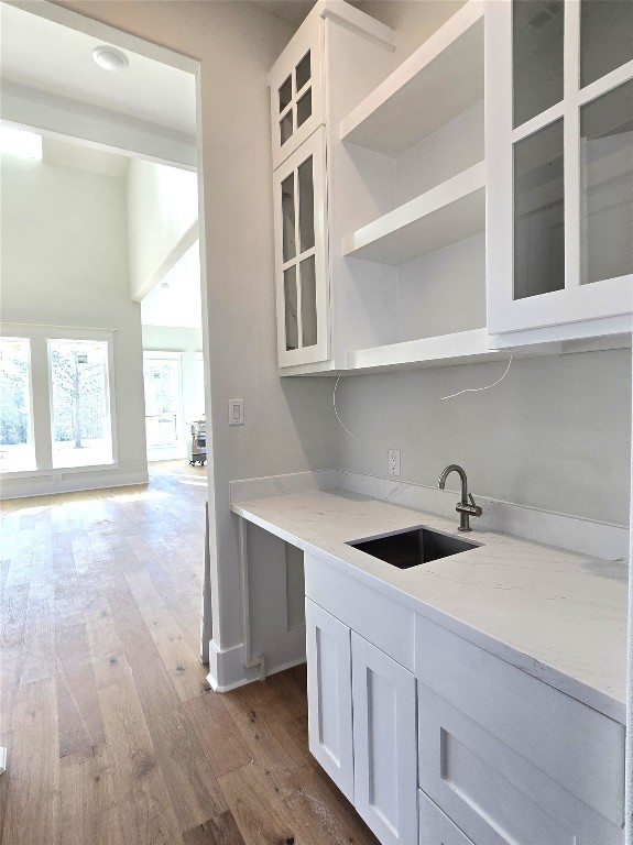 15408 Highlander Court Montgomery, TX 77356 - Photo 6 of 35 a kitchen with a sink and cabinets