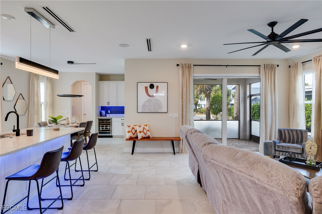 16549 Timber Lane Punta Gorda, FL 33982 - Photo 16 of 30 a living room with furniture and a large window