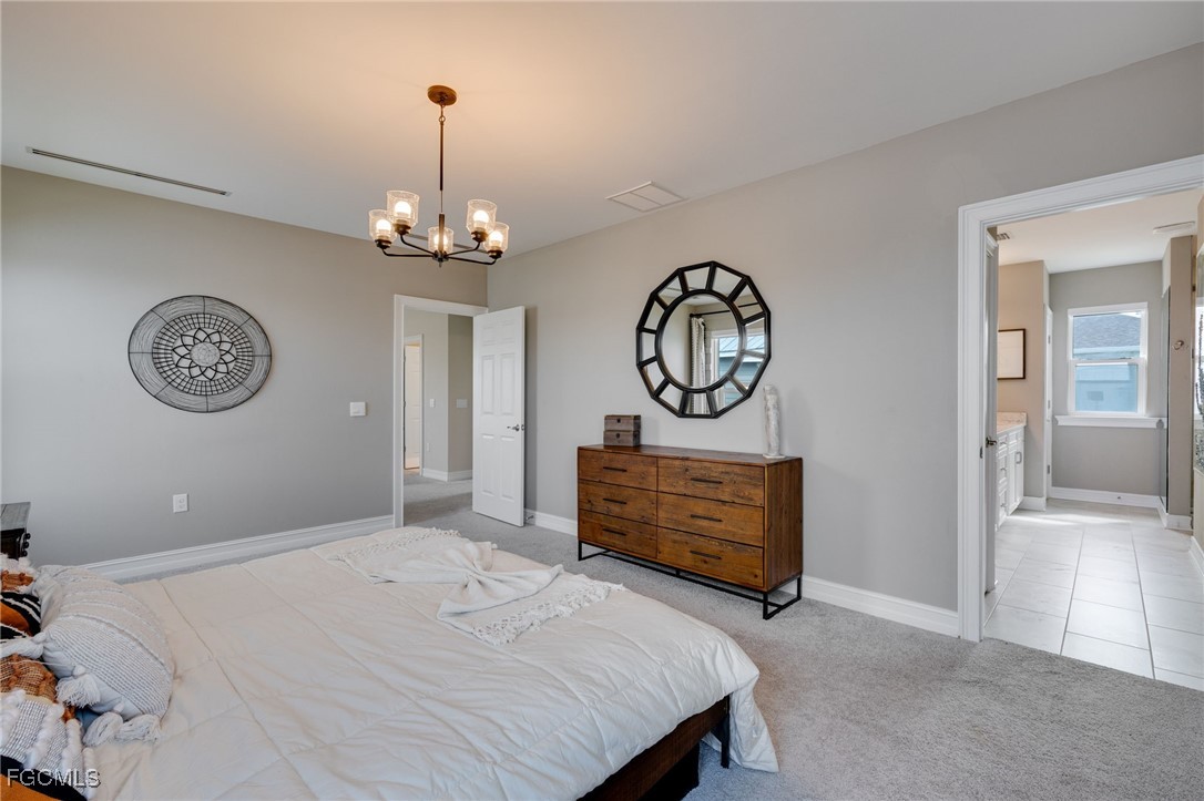 16549 Timber Lane Punta Gorda, FL 33982 - Photo 17 of 30 a bedroom with bed and a window