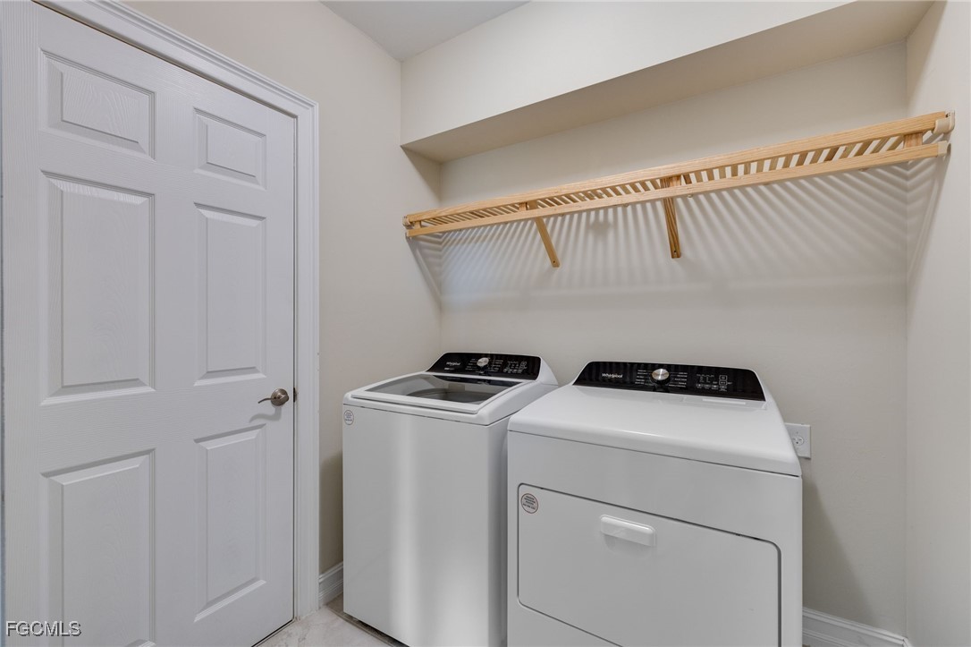 16549 Timber Lane Punta Gorda, FL 33982 - Photo 20 of 30 a utility room with dryer and washer