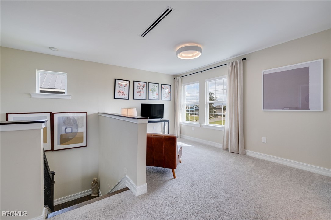 16549 Timber Lane Punta Gorda, FL 33982 - Photo 21 of 30 a living room with furniture and a flat screen tv