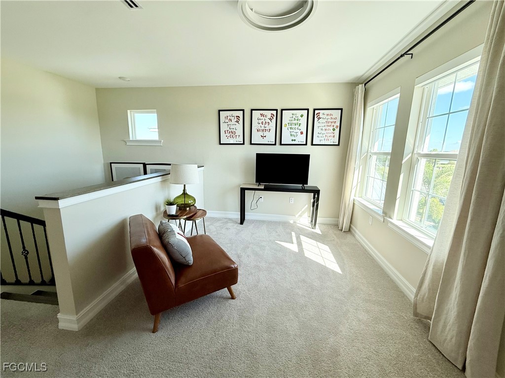 16549 Timber Lane Punta Gorda, FL 33982 - Photo 7 of 30 a living room with furniture and a flat screen tv