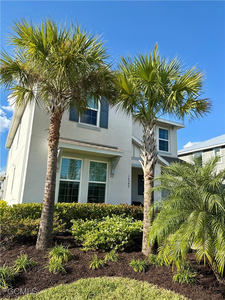 16549 Timber Lane Punta Gorda, FL 33982 - Photo 8 of 30 front view of a house with a yard