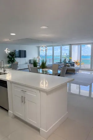 a kitchen with cabinets a sink and a stove