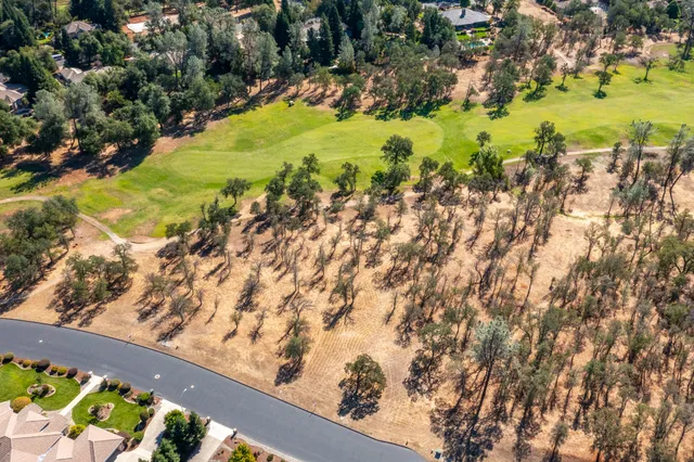 a view of a lake with a yard
