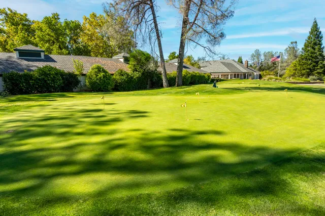 a view of a swimming pool with an outdoor space and seating area