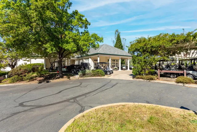 a view of a street with a building and a street sign