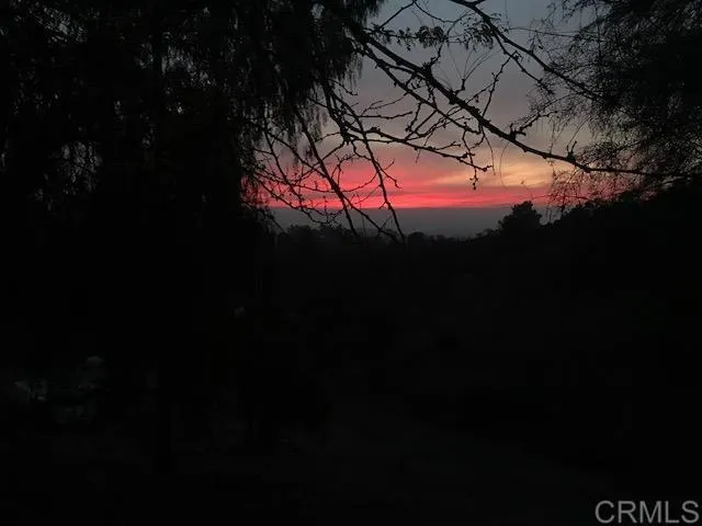a view of an ocean and a mountain