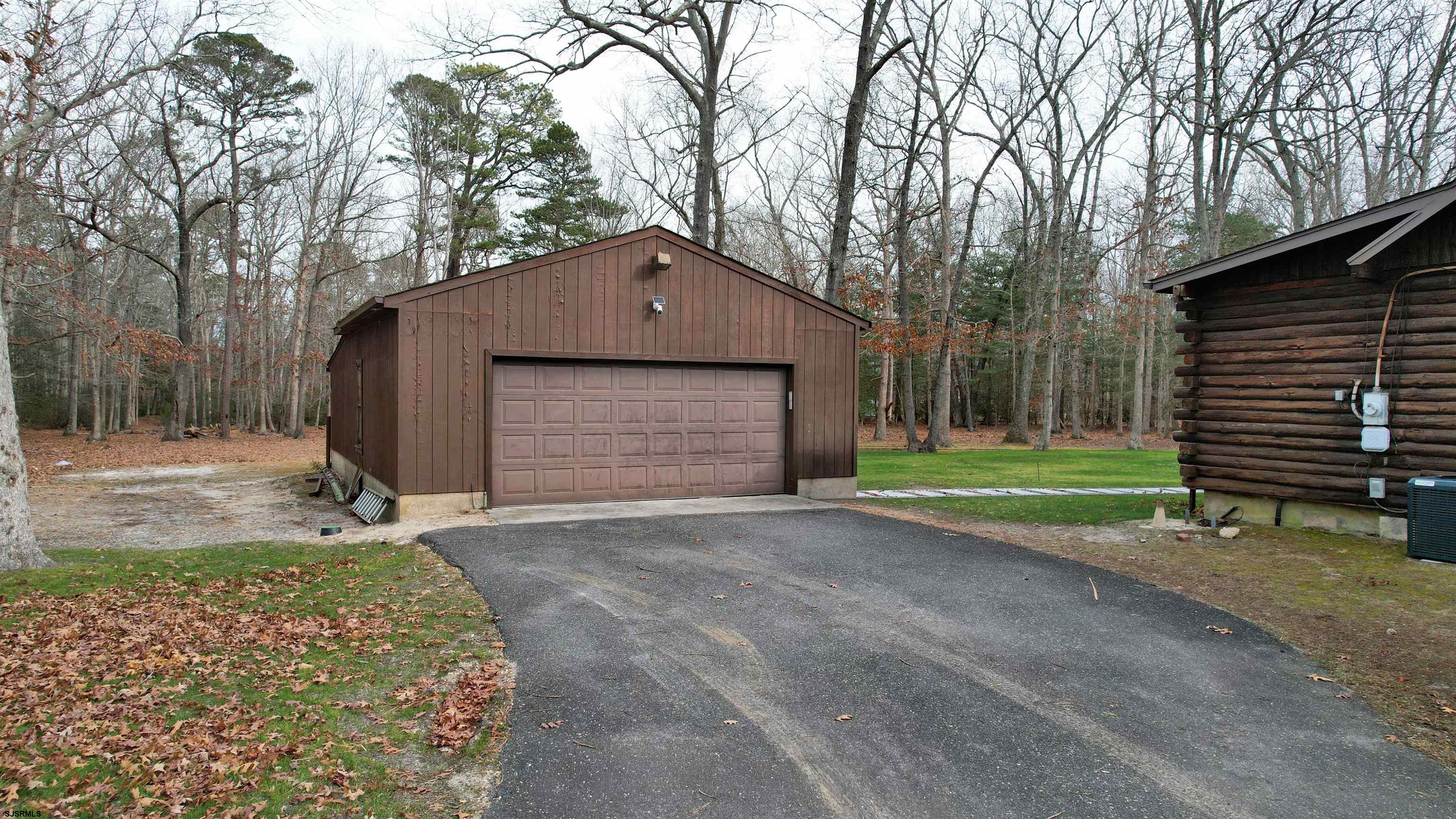853 West Clarks Landing Road Galloway Township, NJ 08215 - Photo 23 of 64 a front view of a house with a yard and garage