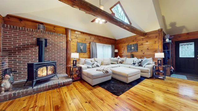 a kitchen with stainless steel appliances a refrigerator a sink a stove and cabinets