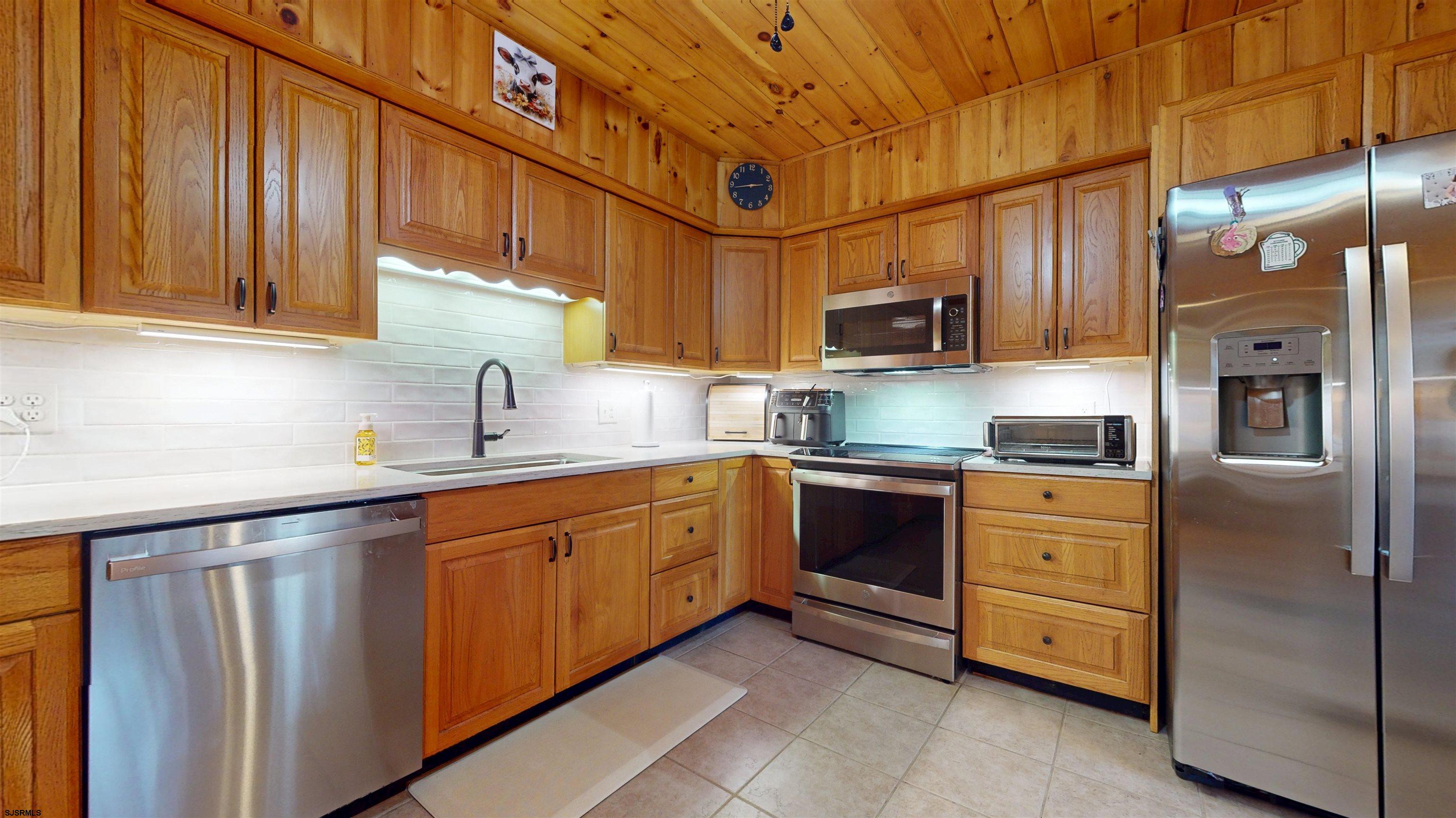 853 West Clarks Landing Road Galloway Township, NJ 08215 - Photo 36 of 64 a kitchen with stainless steel appliances granite countertop a refrigerator and cabinets