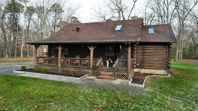 a view of a street with next to a yard