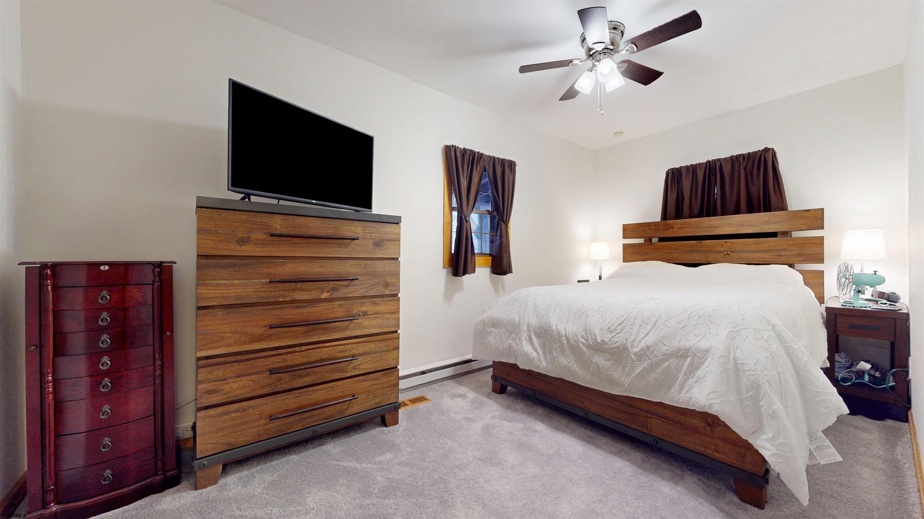 853 West Clarks Landing Road Galloway Township, NJ 08215 - Photo 51 of 64 a bedroom with a bed and a flat screen tv
