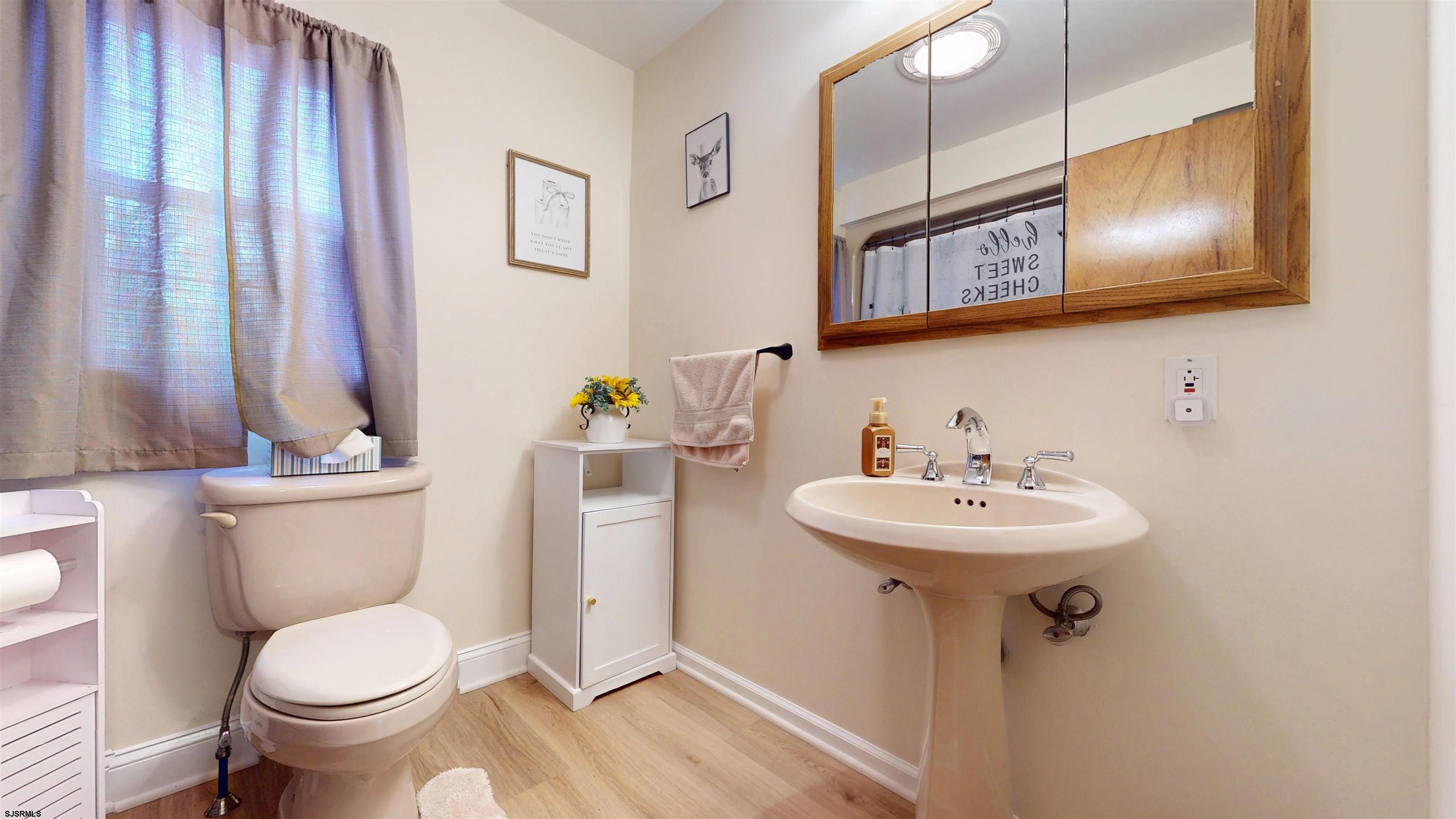 853 West Clarks Landing Road Galloway Township, NJ 08215 - Photo 54 of 64 a bathroom with a toilet sink and mirror