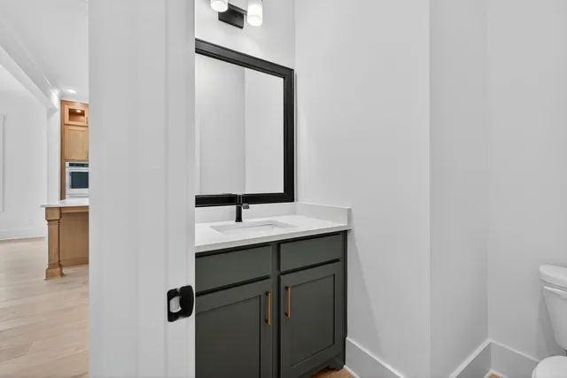 a bathroom with a double vanity sink and mirror