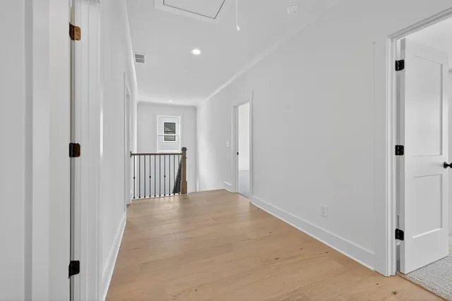 a view of a hallway with white walls