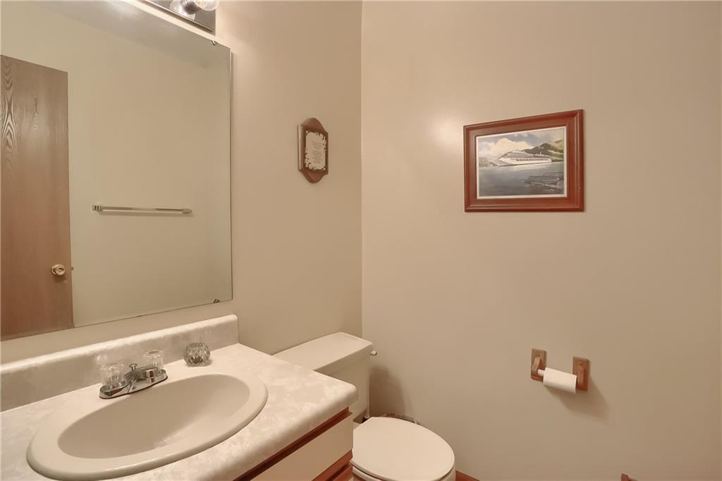 9250 Highland Road Pittsburgh, PA 15237 - Photo 12 of 25 The half bath is on the main level and it features newer laminate flooring.