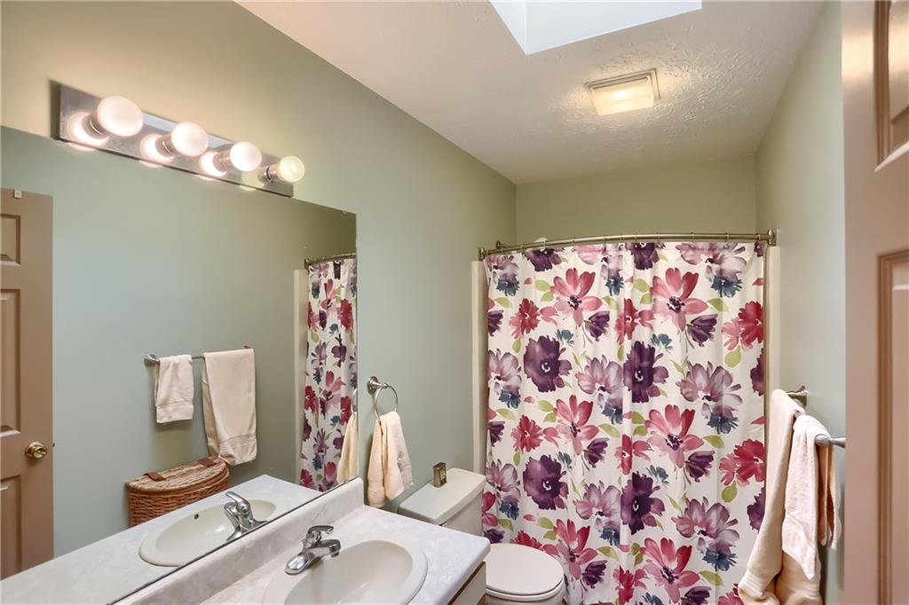 9250 Highland Road Pittsburgh, PA 15237 - Photo 22 of 25 The full bath has a newer vinyl floor and a skylight!