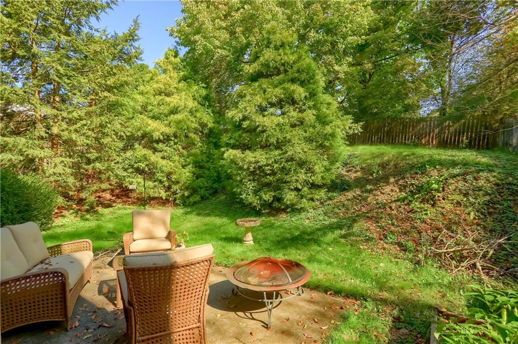 9250 Highland Road Pittsburgh, PA 15237 - Photo 23 of 25 The patio is a serene place to enjoy the natural beauty of the back yard.