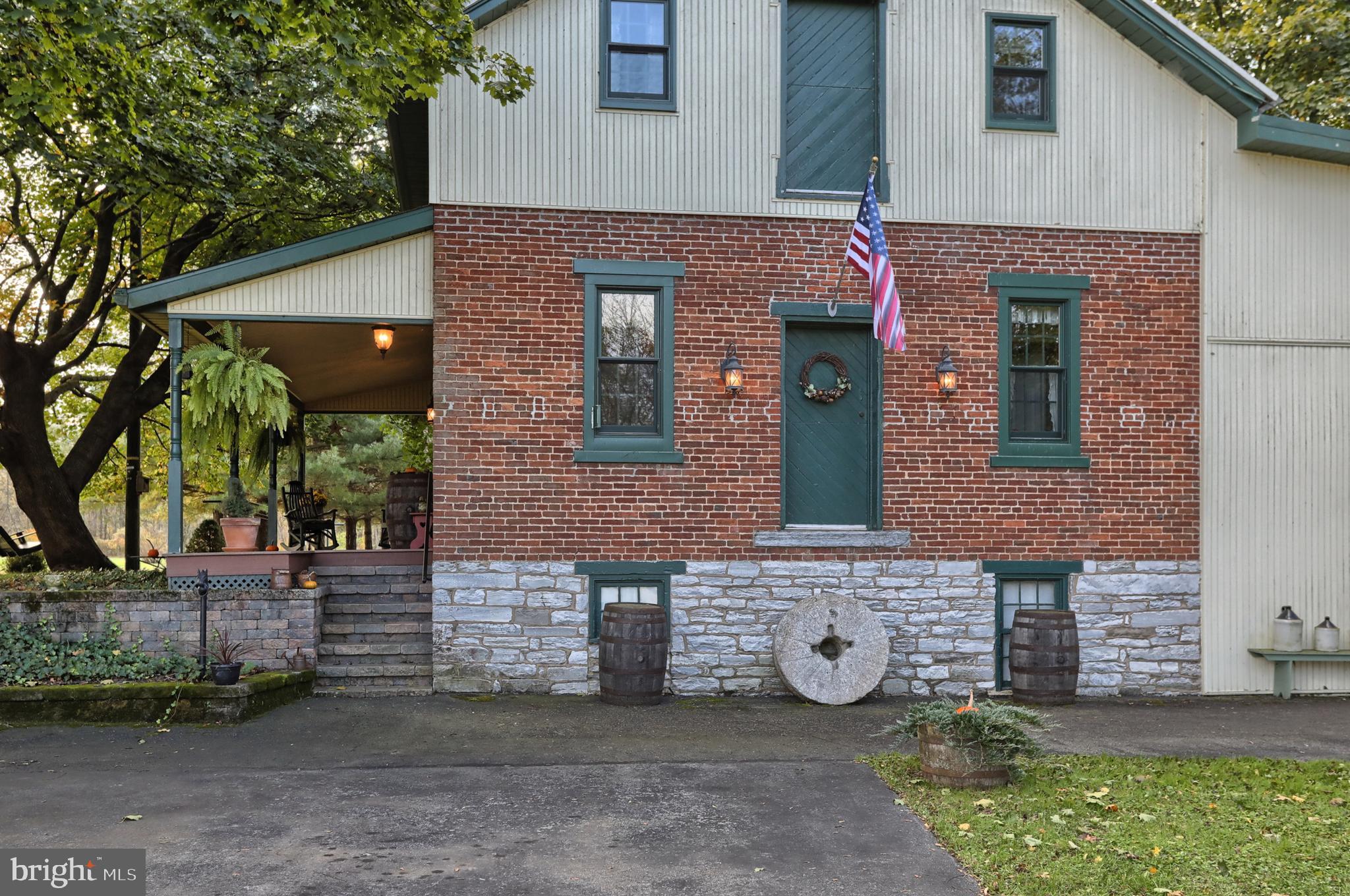 Original millstone pictured conveys with property