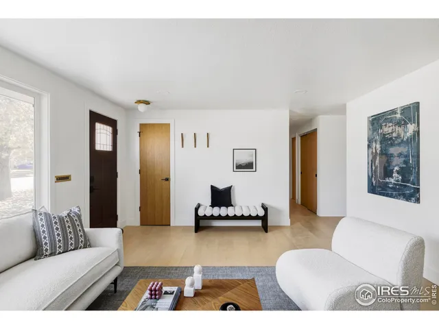 a living room with furniture and a rug